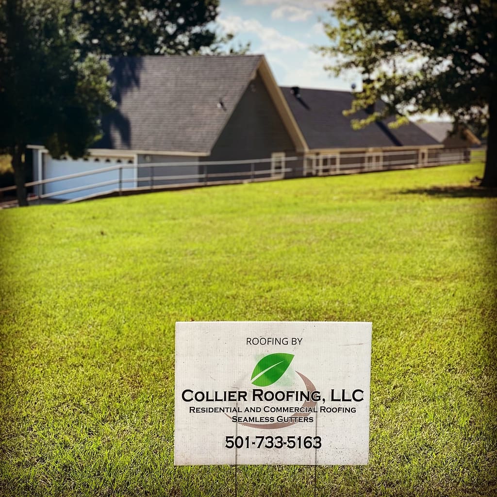 home with new roof with a yard sign by conway roofing company collier roofing in the yard